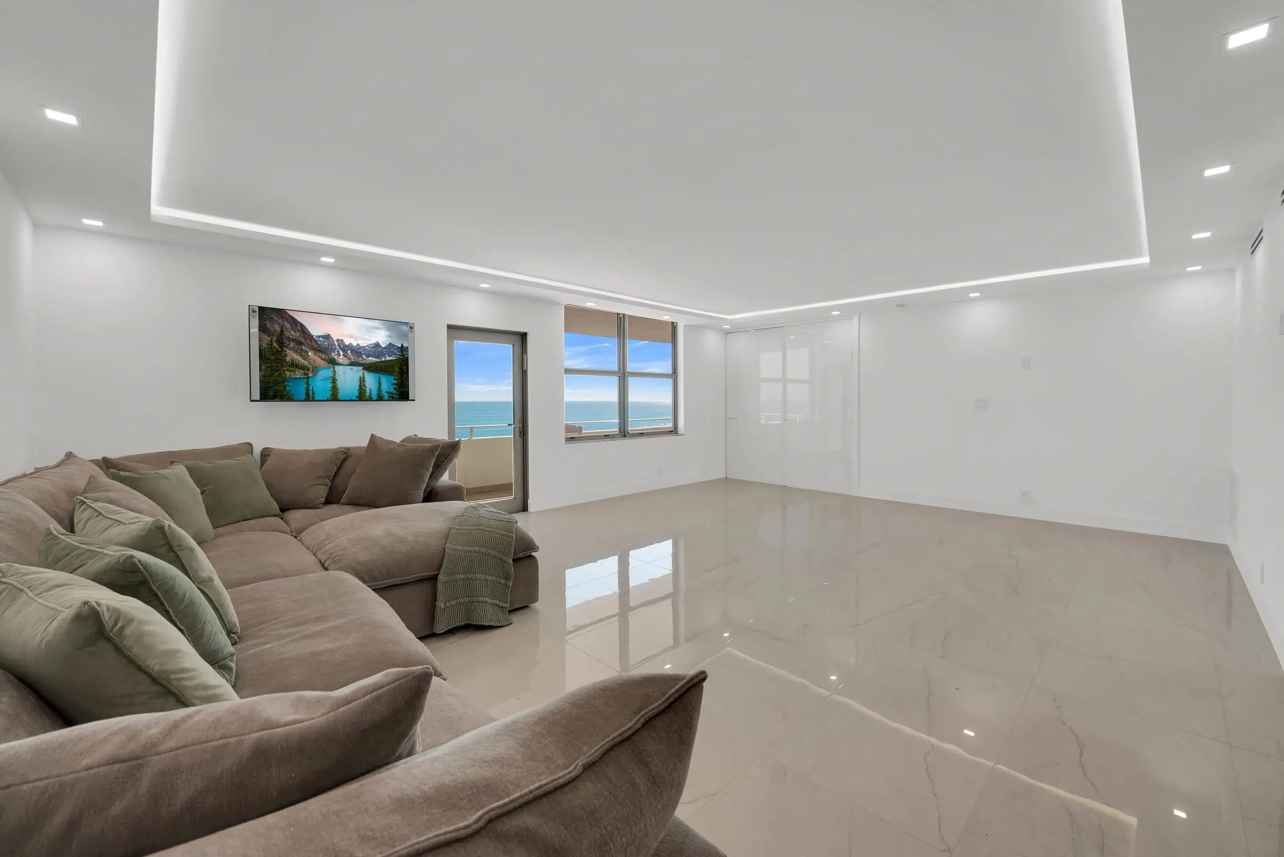 Professionally edited ocean-view living room photograph