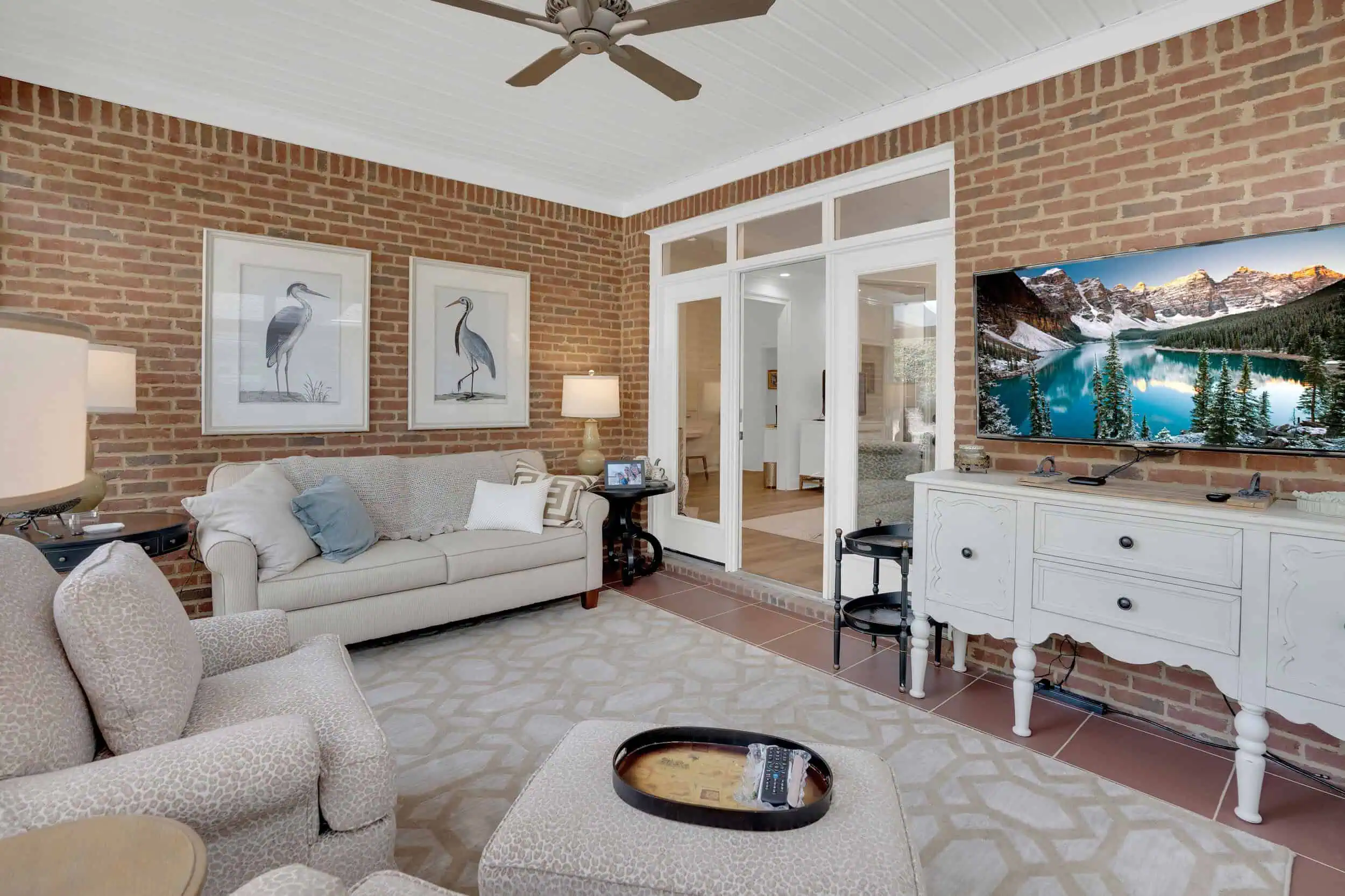 Professionally edited brick sunroom property photograph