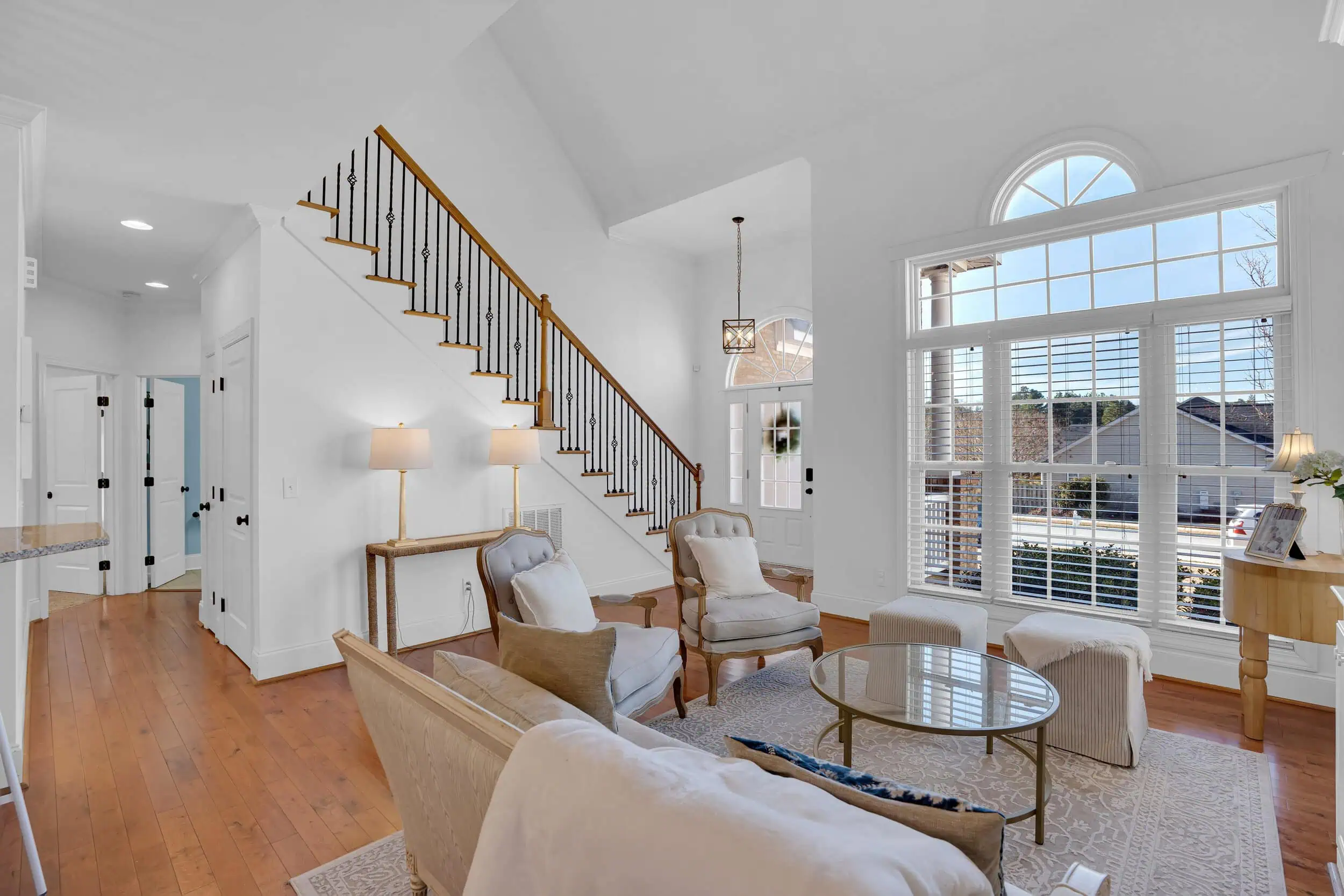 Professionally edited staircase and living area photograph