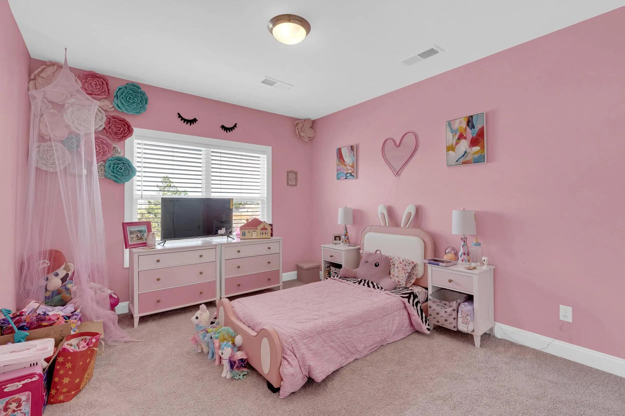Professionally edited pink bedroom property photograph