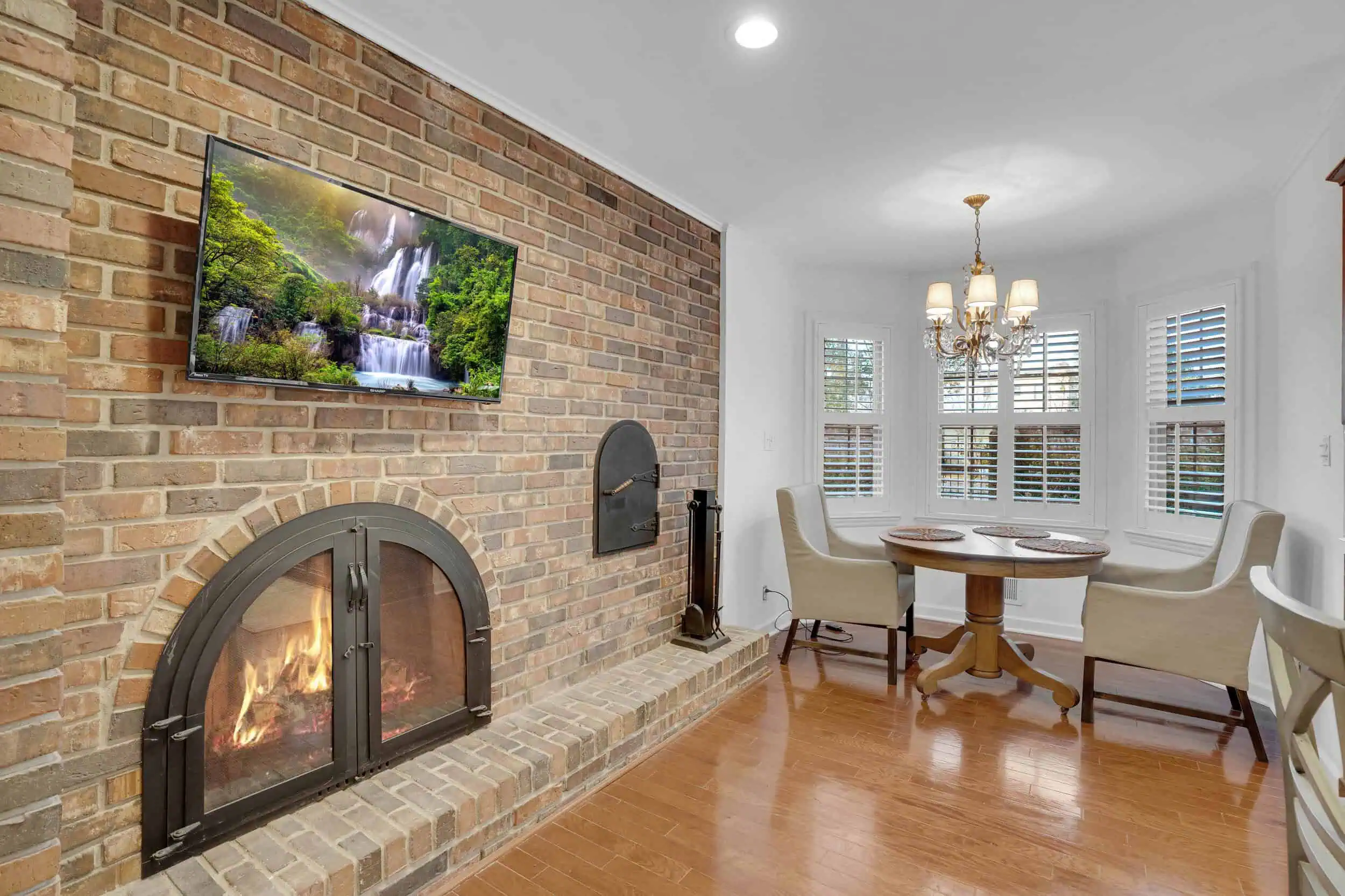 Professionally edited kitchen with brick fireplace