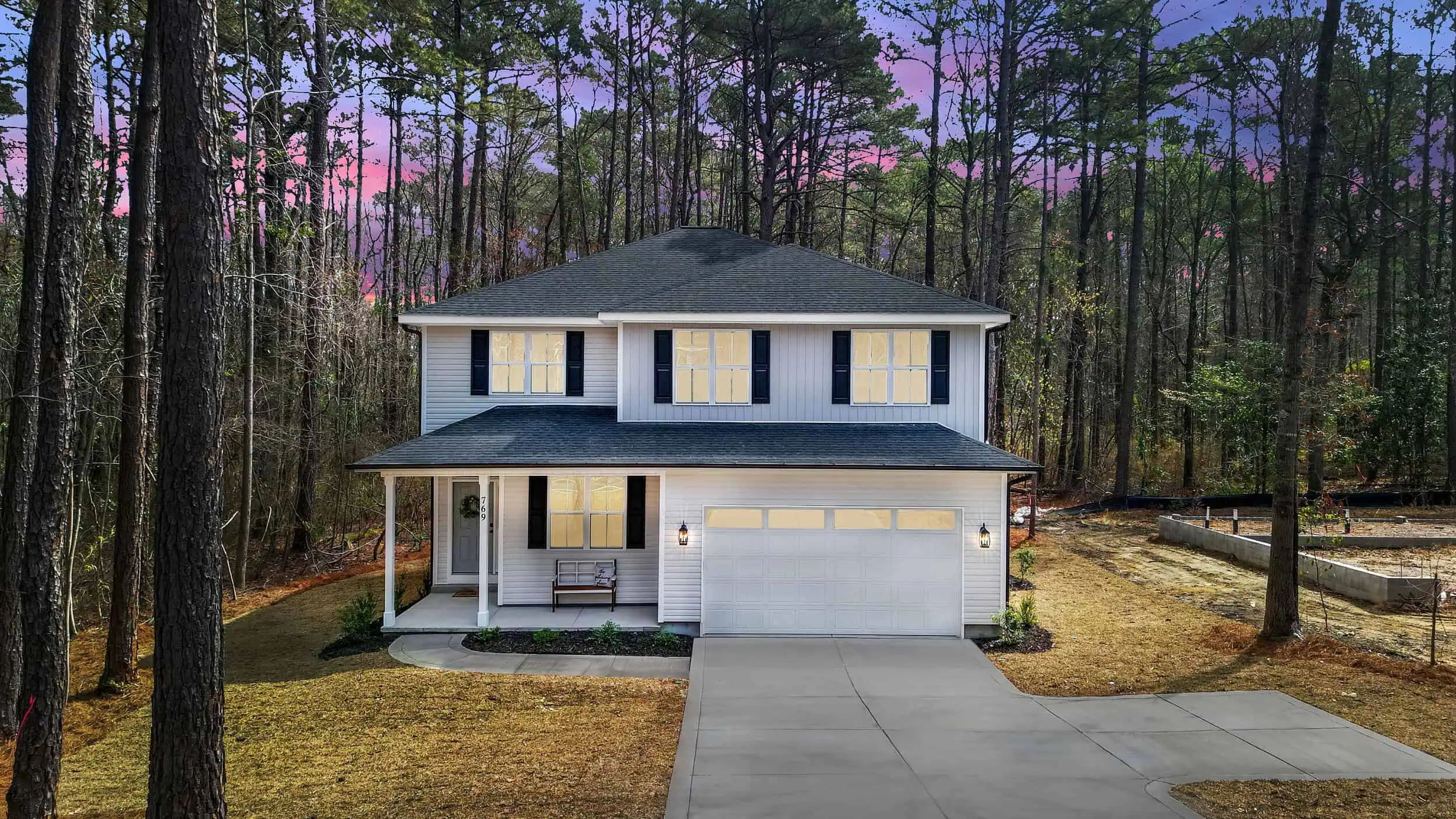 Professionally edited woodland home exterior at twilight